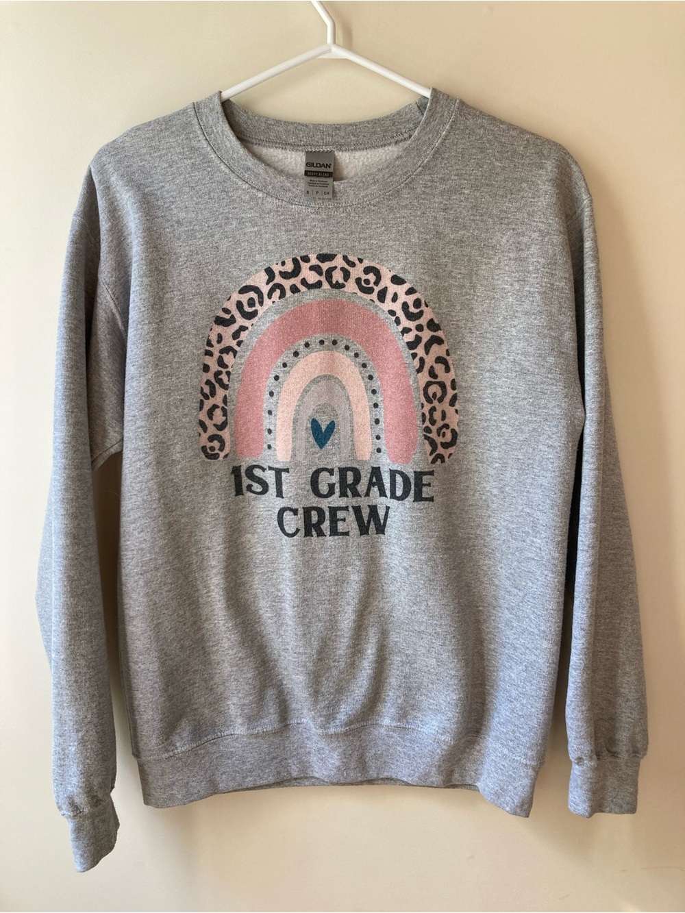 First Grade Teacher Crewneck Sweater with Pink Leopard Rainbow Graphic